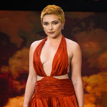 florence pugh coordinated her fiery hair with hip grazing cut out gown