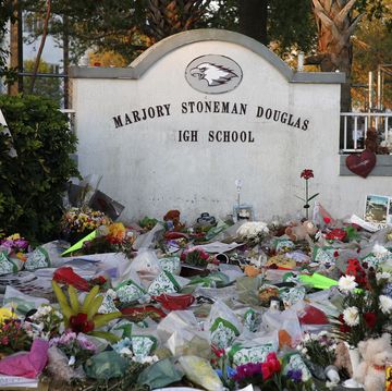 flowers, candles and mementos sit outside one of the makeshift memorials at marjory stoneman douglas high school in parkland, florida on february 27, 2018
floridas marjory stoneman douglas high school will reopen on february 28, 2018 two weeks after 17 people were killed in a shooting by former student, nikolas cruz, leaving 17 people dead and 15 injured on february 14, 2018  afp photo  rhona wise        photo credit should read rhona wiseafp via getty images